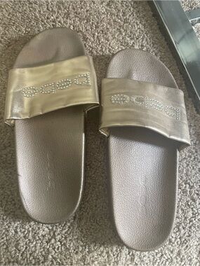 bebe Metallic Gold Rhinestone Logo Slide Sandals. Size 10